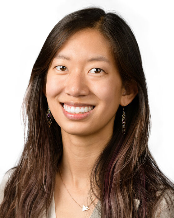 A headshot of Anna Li who is smiling at the camera