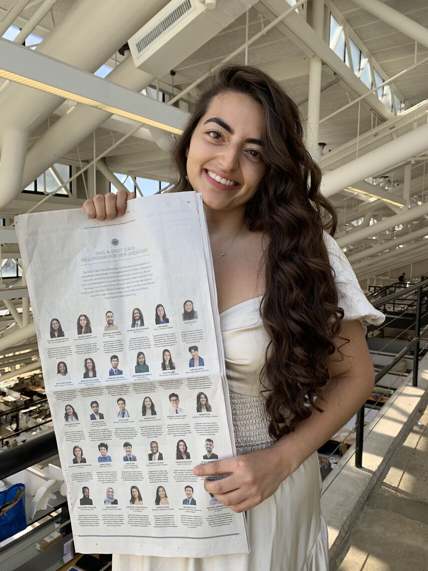 leslie ponce diaz holding the new york times advertisement at the harvard graduate school of design