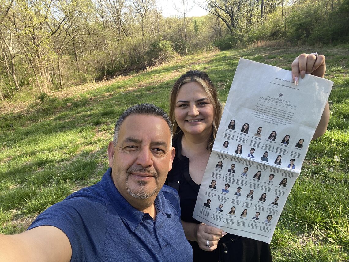 the parents of leslie ponce diaz holding the new york times ad in kansas city where leslie grew up
